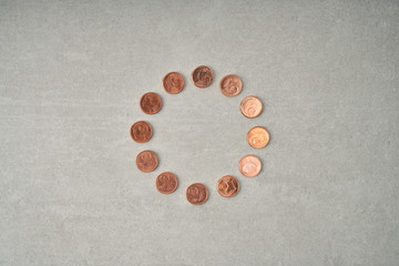 One euro coins symbolise the twelve stars of the european flag