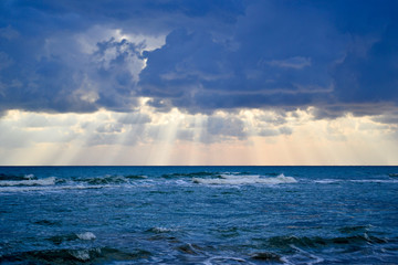 Tropical beach with colorful sunset, cloudy sky. A copy of the space.