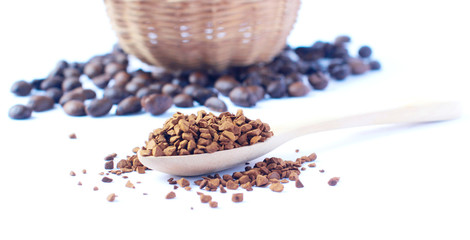 Freeze dried coffee., Wooden spoon with granulated Instant Coffee., close-up on white background.
