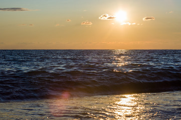 Amazing sea sunset, the sun, waves, clouds