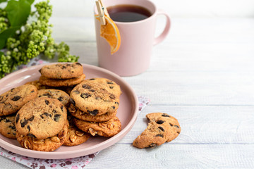 Chocolate Chip Cookies. Homemade baking. Round shape, medium size. On a white wooden background.