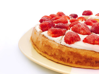 Sponge cake with strawberry and white cream isolated
