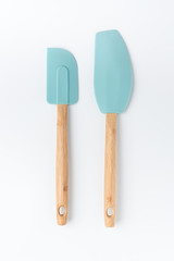 Fototapeta Silicone mixer and scraper spatula with bamboo handle on a white background obraz