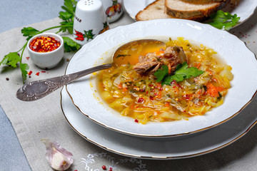 Homemade soup with fresh cabbage and oxtails.
