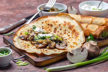 Pancakes with mushroom and cabbage filling for breakfast.