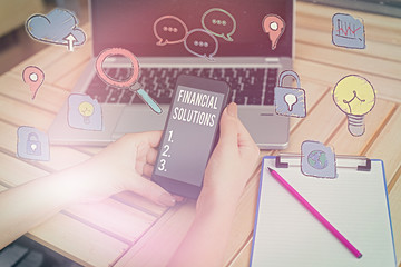 Writing note showing Financial Solutions. Business concept for to Save Money on Insurance and Protection Needs