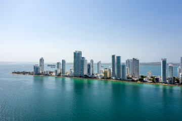 Fototapeta na wymiar Aerial View of the hotels and tall apartment buildings near the Caribbean coast. Modern City Skyline.