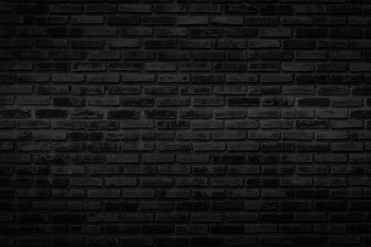 Black brick walls that are not plastered background and texture. The texture of the brick is black. Background of empty brick basement wall. © lllonajalll