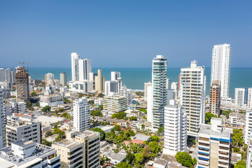 Obraz premium Aerial view of a skyline of white residential skyscrapers in Cartagena's prestigious Bocagrande district.