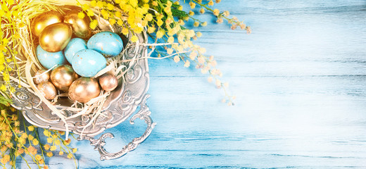 Easter background with willowe tree branches and eggs