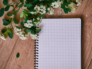 Top view of open blank notebook, bouquet, flower. Travel and adventure concept, journey diary