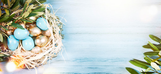 Easter background with olive tree branches and eggs