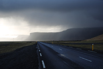 Iceland empty road with the mountains in the background