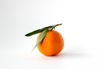 Mandarin with green leaves on a white background