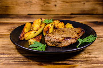 Roasted beefsteak with the fried potato and parsley