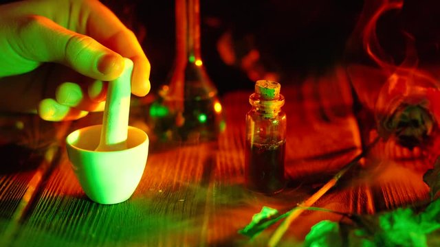 Witchcraft. Witch doctor desk table. Magic potion. ALternative medicine concept. Divination, love potion. Mysterious clouds of smoke.