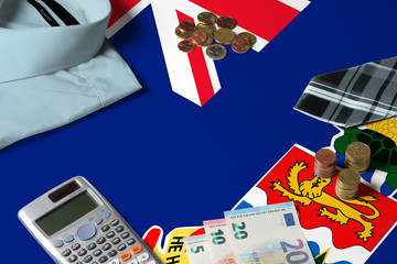 Cayman Islands flag on minimal money concept table. Coins and financial objects on flag surface. National economy theme.