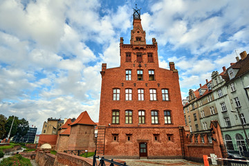 Obraz premium The facade of red historic brick building in Poznan.