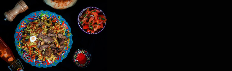 Samarkand pilaf with wegetables. on the black space background
