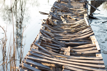 Wooden Pallet Bridge. Ruined wooden bridge.