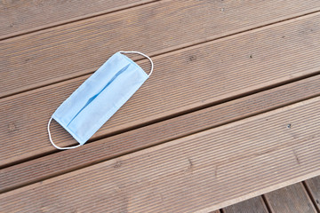 Abandoned protective mask on a bench in a public park after the end of the covid-19 pandemic, Coronavirus