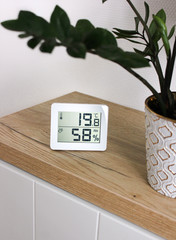Thermometer hygrometer measuring the optimum temperature and humidity in a house, apartment or...