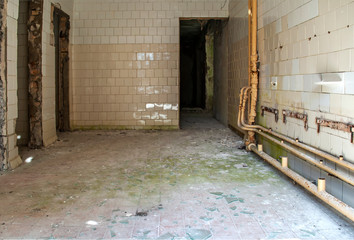 Old abandoned building, empty broken laundry room, utility room. Life after people. Apocalyptic future. Old abandoned children's camp. Chernobyl zone. Despondency and hopelessness.