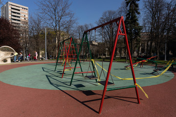 BELGRADE, SERBIA - APRIL 04, 2020: Empty children playground.  Banned for use due to Coronavirus in Serbia. Prevetnion of spreading COVID19