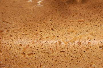Bread with wheat seeds, close-up with a pleasant warm shade