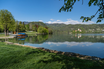 Obraz premium Bled, Sloveina, April 22, 2020: Lake shore with all the boats tied to the dock, due to coronavirus lockdown