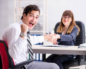 Man and woman discussing in office