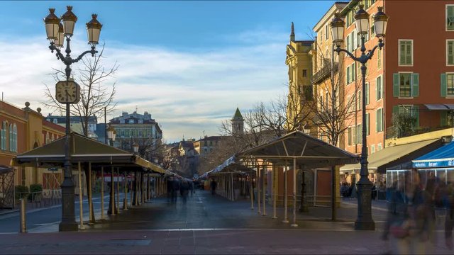 Empty Market timelapse due to Covid-19 in Cours Saleya, Nizza (Nice) France with few people walking around, the historical buildings and restaurants 
