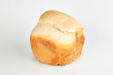 homemade french wheat loaf. candid at isolation time.  over gray background.