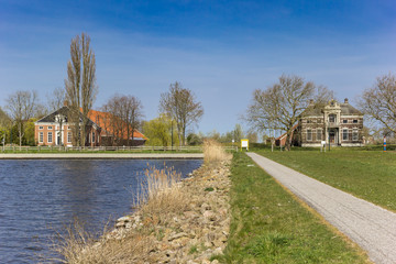 Fototapeta na wymiar Historic houses at the Oldambtmeer lake in Oostwold, Netherlands