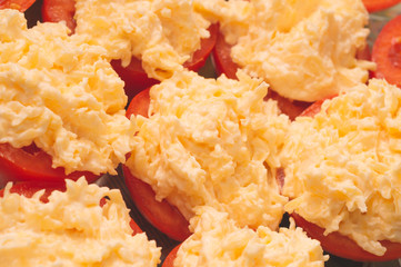 Tomato with cheese and parsley. appetizer from vegetables. halves of tomatoes with cheesy cream