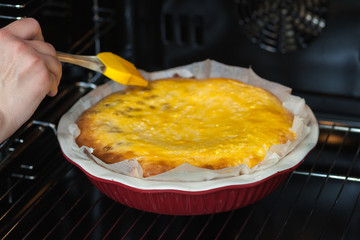 Oven baked cottage cheese casserole. In red baking dish
