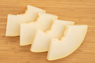 Fresh melon on a wooden board.