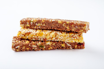 brown granola bars on white background
