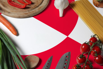 Greenland flag on fresh vegetables and knife concept wooden table. Cooking concept with preparing background theme.