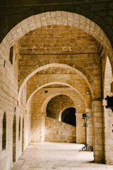 Fototapeta na wymiar Fort Lovrienac inside. Ancient stone arched corridor in Lovrienac fortress in Dubrovnik