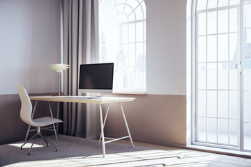 Modern coworking office interior with computers on table