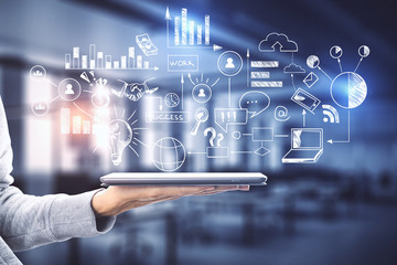Hand holding digital tablet with global marketing plan