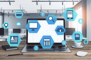 Office with laptop on table and cloud computing diagram.