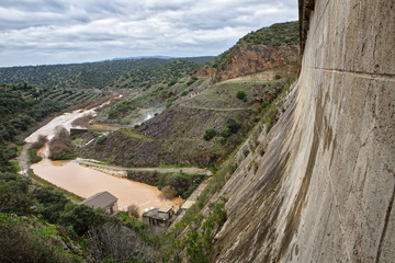 Fototapeta na wymiar Reservoir Rumblar, expelling water after several months of rain, Jaen, Spain