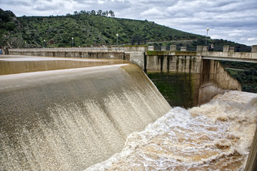 Reservoir Jándula, expelling water after several months of rain, Jaen, Spain