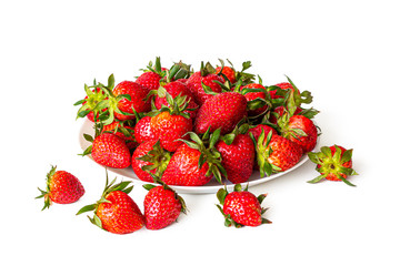 Red, juicy strawberries in a white plate