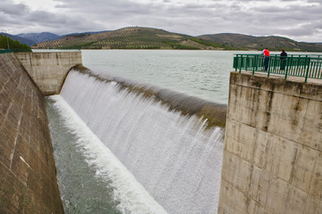 Colomera reservoir releasing water after heavy rains of winter, is situated on the river Colomera and Juntas, near the town of Colomera, in the province of Granada, Spain