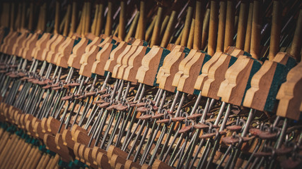 inside of old open dirty piano close up