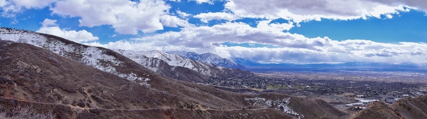 Fototapeta na wymiar Salt Lake Valley and City panoramic views from the Red Butte Trail to the Living Room, Wasatch Front, Rocky Mountains in Utah early spring. Hiking view of trails around the University and Gardens and 