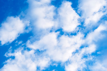 Obraz premium Bright blue sky with fluffy white clouds. Perfect backdrop!